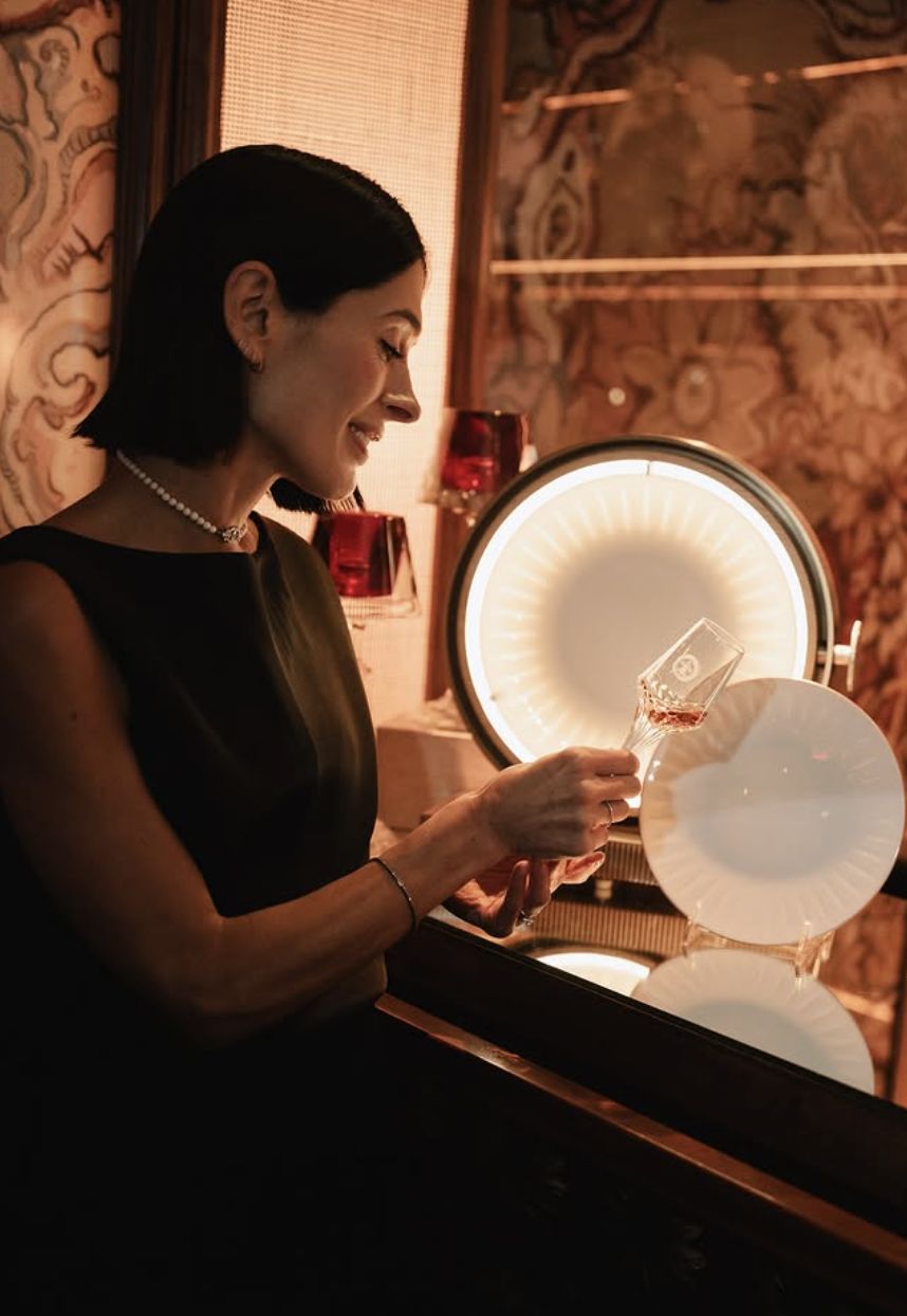 A guest admiring a glass of Louis XIII